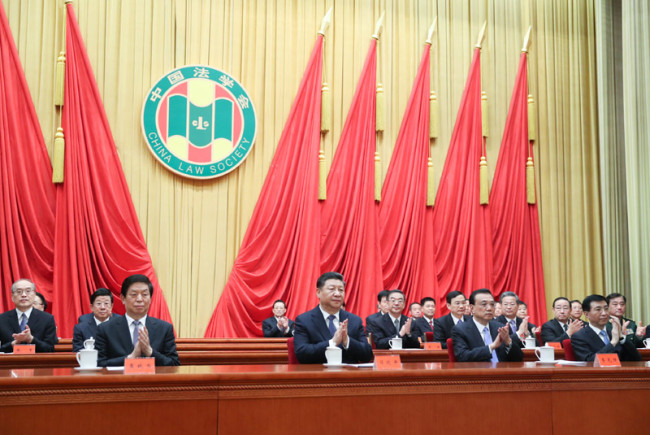 Chinese President Xi Jinping and other Communist Party of China and state leaders Li Keqiang, Li Zhanshu and Wang Huning attend the opening ceremony of the eighth congress of the China Law Society and extend their congratulations to the congress in Beijing, capital of China, March 19, 2019. [Photo: Xinhua]