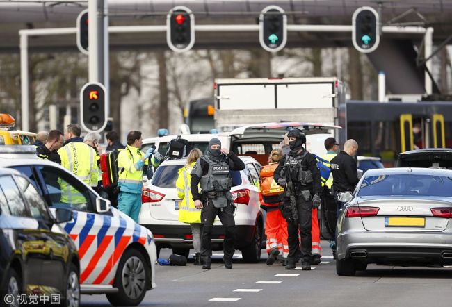Emergency services stand at the 24 Oktoberplace in Utrecht, on March 18, 2019 where a shooting took place. [Photo: VCG]