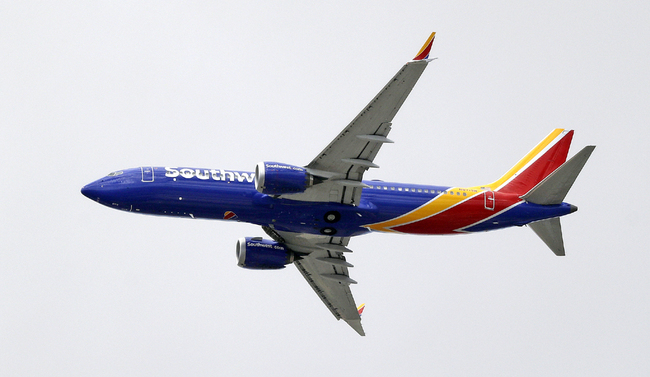 A Southwest Airlines Boeing 737 MAX 8 jet flies over Mesa, Ariz., en route to Phoenix's Sky Harbor International Airport on March 13, 2019. [Photo: AP/Elaine Thompson]