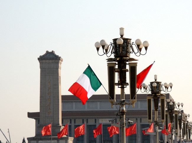 The national flags of China and Italy flying in front of the Tiananmen Rostrum during the visit by Italy's President Sergio Mattarella to Beijing on February 23, 2017. [File photo: IC]