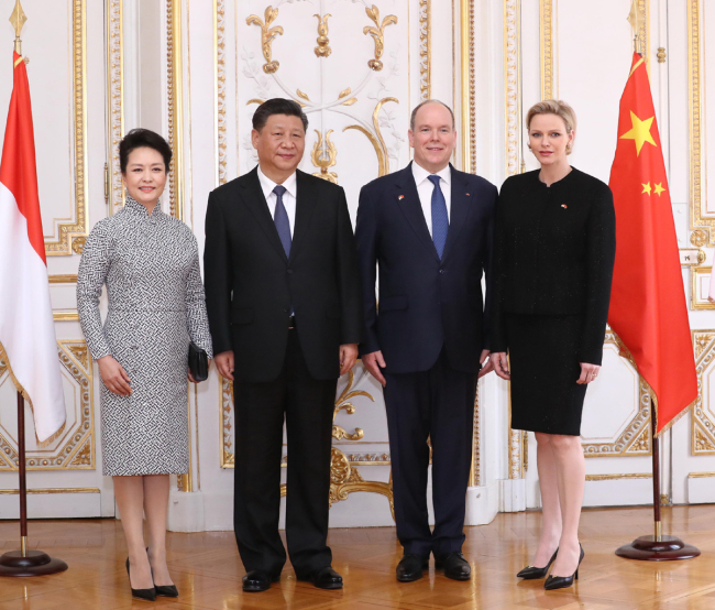 Chinese President Xi Jinping (2nd L) and his wife Peng Liyuan (1st L) pose for a group photo with Prince Albert II (2nd R) and his wife Princess Charlene in Monaco, March 24, 2019. [Photo: Xinhua/Ju Peng]