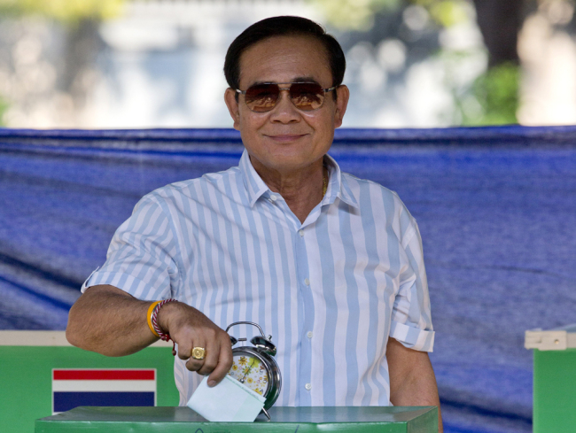 Thailand's Prime Minister Prayuth Chan-ocha casts his vote at a polling station in Bangkok, Thailand, March 24, 2019, during the nation's first general election since the military seized power in a 2014 coup.  [Photo: AP/Gemunu Amarasinghe]