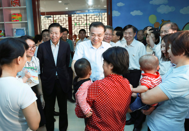 Chinese Premier Li Keqiang visits an elderly care center in a tour to south China's Hainan Province during the ongoing Boao Forum for Asia annual conference on Wednesday, March 27, 2019. [Photo: gov.cn]