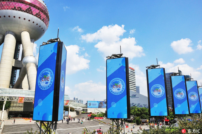 Signboards of the China International Import Expo (CIIE) are seen in front of the Oriental Pearl TV Tower at the Lujiazui Financial District in Pudong in Shanghai, China, 11 October 2018. [File photo:IC]