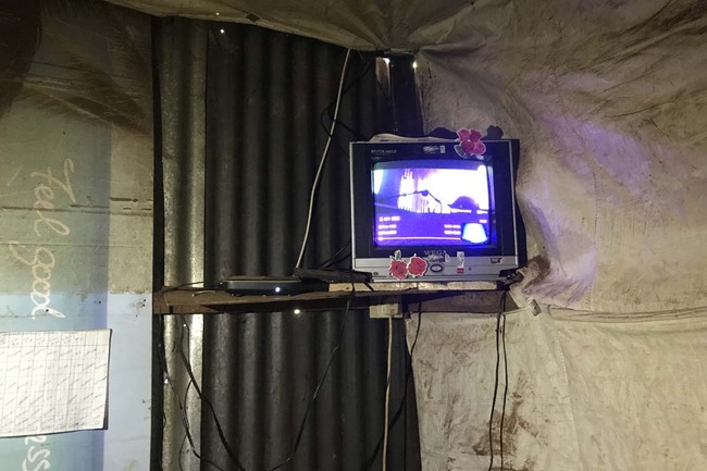 A television is showing pictures in one of the households in the Kenyan village of Uthiru. China's StarTimes carried out television connection project there to help local villagers access TV services. [Photo provided to China Plus]