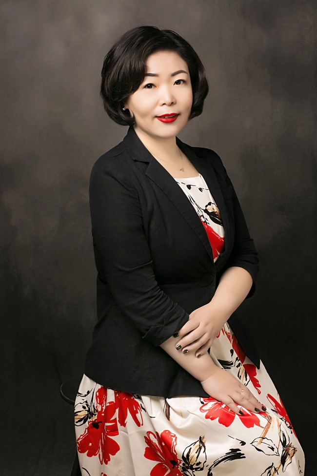 Wang Qian, an insurance agent based in Beijing. [File photo provided to China Plus]