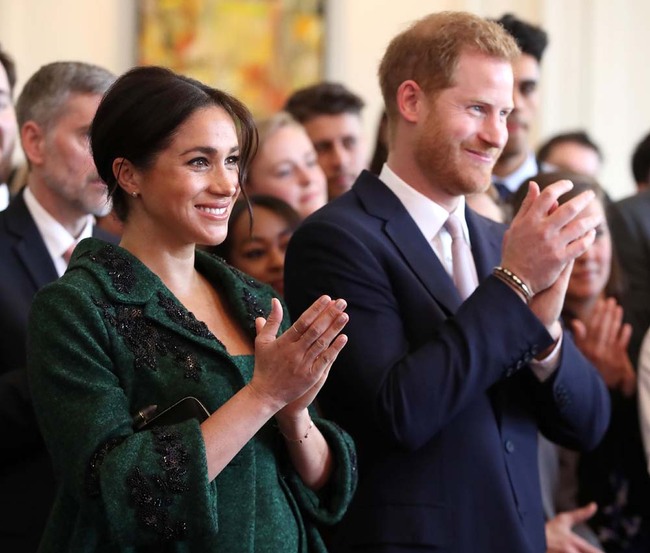 Meghan, Duchess of Sussex (L) and Britain's Prince Harry, Duke of Sussex, watch a musical performance at Canada House, the offices of the High Commission of Canada in the United Kingdom, during an event to mark Commonwealth Day, in central London, on March 11, 2019. [Photo: AFP]