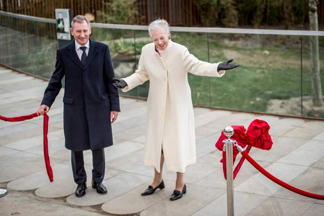 Queen Margrethe of Denmark cuts a ribbon to inaugurate an enclosure for two pandas recently arrived from China on April 10, 2019 at Copenhagen's zoo. [Photo: Ritzau Scanpix via VCG/Mads Claus Rasmussen]