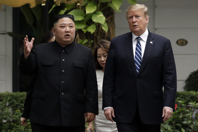 U.S. Pesident Donald Trump and DPRK leader Kim Jong Un take a walk after their first meeting at the Sofitel Legend Metropole Hanoi hotel, Thursday, Feb. 28, 2019, in Hanoi. [File photo: AP/Evan Vucci]