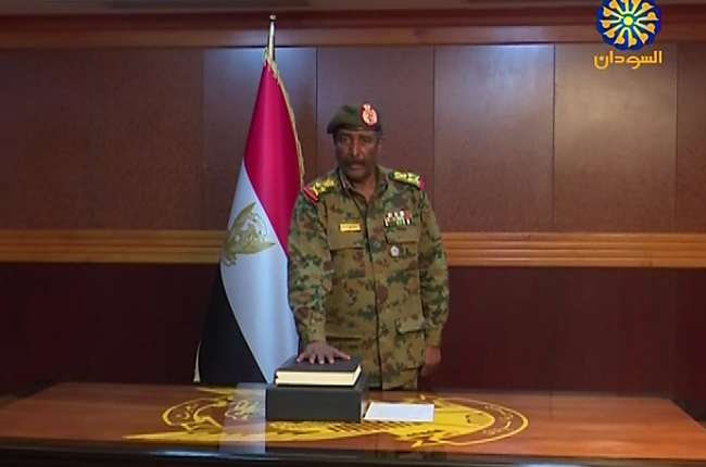 A grab from a broadcast on Sudan TV shows General Abdel Fattah al-Burhan Abdulrahman taking oath on April 12, 2019 as chief of the new military council, in the capital Khartoum. Sudan's military council chief General Awad Ibn Ouf announced on April 12 he was stepping down in favour of General Abdel Fattah al-Burhan Abdulrahman to succeed him, just a day after he was sworn in following the ouster of veteran president Omar al-Bashir. [Photo: Sudan TV via AFP]