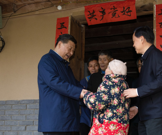 Chinese President Xi Jinping, also general secretary of the Communist Party of China Central Committee and chairman of the Central Military Commission, visits house of Tan Dengzhou, an impoverished villager, during his inspection tour in Shizhu Tujia Autonomous County, Chongqing on April 15, 2019. [Photo: Xinhua]