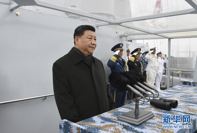 Chinese President and Central Military Commission Chairman Xi Jinping reviews a naval parade in the city of Qingdao, Shandong Province on Tuesday, April 23, 2019. [Photo: Xinhua]