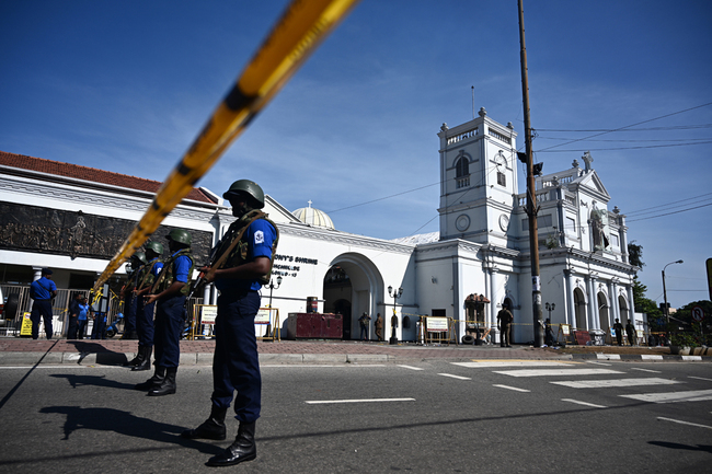 Security personnel stand guard outside St. Anthony's Shrine in Colombo on April 22, 2019, a day after the church was hit in series of bomb blasts targeting churches and luxury hotels in Sri Lanka.[Photo: AFP/Jewel SAMAD]