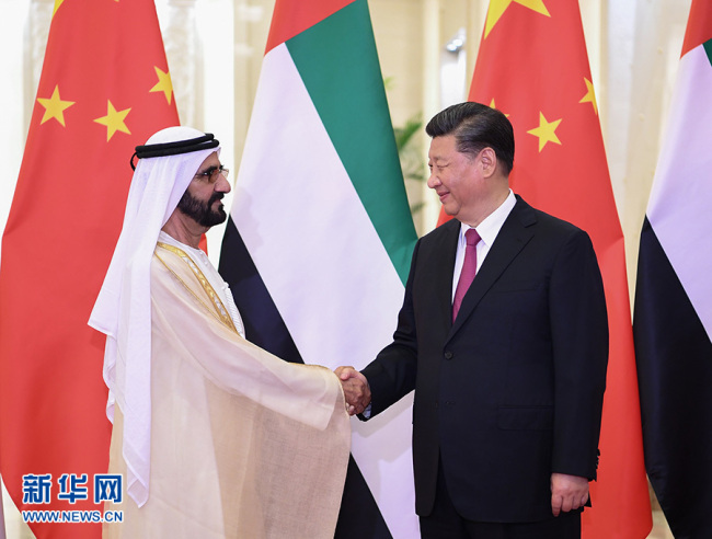 Chinese President Xi Jinping (R) shakes hands with the United Arab Emirates (UAE) Vice President and Prime Minister Sheikh Mohammed bin Rashid Al Maktoum on Thursday, April 25, at the Great Hall of the People, in Beijing. [Photo: Xinhua]