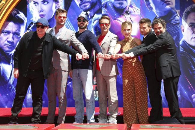 Marvel Studios President Kevin Feige, from left, poses with members of the cast of "Avengers: End Game," Chris Hemsworth, Chris Evans, Robert Downey Jr., Scarlett Johansson, Jeremy Renner and Mark Ruffalo at a hand and footprint ceremony at the TCL Chinese Theatre on Tuesday, April 23, 2019, in Los Angeles. [Photo: AP]