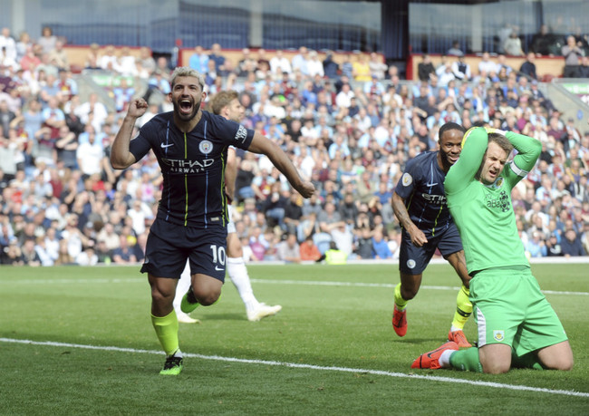 Manchester City's Sergio Aguero, left, celebrates after scoring his side's opening goal during the English Premier League soccer match against Burnley at Turf Moor in Burnley, England on Sunday, April 28, 2019. [Photo: AP]