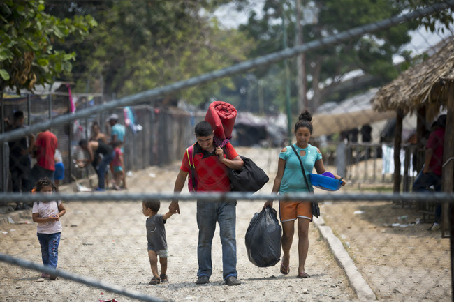 Gribil Mejia Tinoco, from Santa Barbara, Honduras, center, with his wife Heidi and children, leaves a shelter where they stayed for one month before getting temporary permission to stay in Mexico, in Mapastepec, Chiapas state, Mexico, Sunday, April 28, 2019. This week, Central American migrants who traveled in caravans to the U.S. have begun receiving a Mexican government ID that allows them to stay for five years on Mexico's southern border with Guatemala, prompting them to leave the shelters. [AP Photo/Moises Castillo]