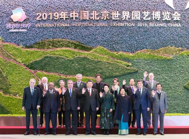 Chinese President Xi Jinping and his wife Peng Liyuan pose for a group photo with foreign leaders before the opening ceremony of the International Horticultural Exhibition 2019 Beijing in Yanqing District of Beijing, capital of China, April 28, 2019. [Photo: Xinhua]