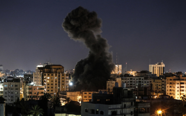 A plume of smoke billows above buildings during an Israeli airstike on Gaza City on May 4, 2019. Gaza militants fired a barrage of rockets at Israel, which responded with airstrikes, officials said, as a fragile ceasefire again faltered. [Photo: AFP]