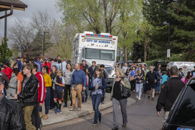 Students are evacuated from the Recreation Center at Northridge in Highlands Ranch after a shooting at the STEM School Highlands Ranch on May 7, 2019. [Photo: AFP/Chet Strange]
