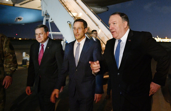 US Secretary of State Mike Pompeo (R) walks with Acting Assistant Secretary for Near Eastern Affairs at the State Department David Satterfield (L), and Charge D'affaires at the US Embassy in Baghdad Joey Hood upon arrival in Baghdad for meetings on May 7, 2019. [Photo: AFP]