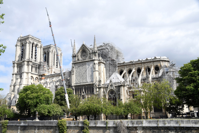 People work as part of the construction work to secure Notre Dame de Paris cathedral that was badly damaged by a huge fire last April 15, on May 10, 2019. [Photo: AFP/BERTRAND GUAY]