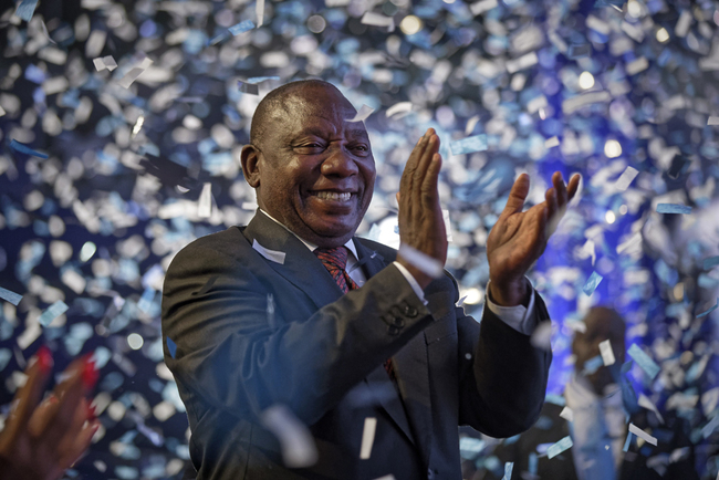 President Cyril Ramaphosa applauds as confetti is launched at the end of the results ceremony at the Independent Electoral Commission Results Center in Pretoria, South Africa Saturday, May 11, 2019. [Photo: AP]