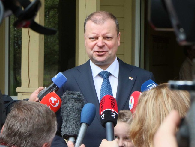 Lithuania's Prime Minister Saulius Skvernelis, talks to journalists during the presidential election in Vilnius on May 12, 2019. [Photo: AFP]