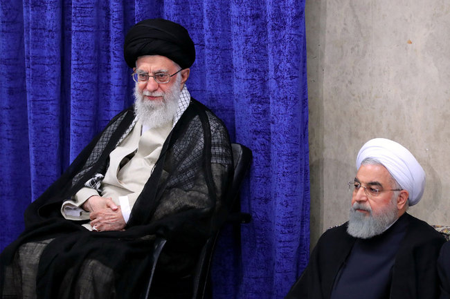 A handout picture provided by the office of Iran's Supreme Leader Ayatollah Ali Khamenei on May 14, 2019, shows Khamenei (L) and President Hassan Rouhani attending a government meeting in the capital Tehran. [File photo: KHAMENEI.IR via AFP]