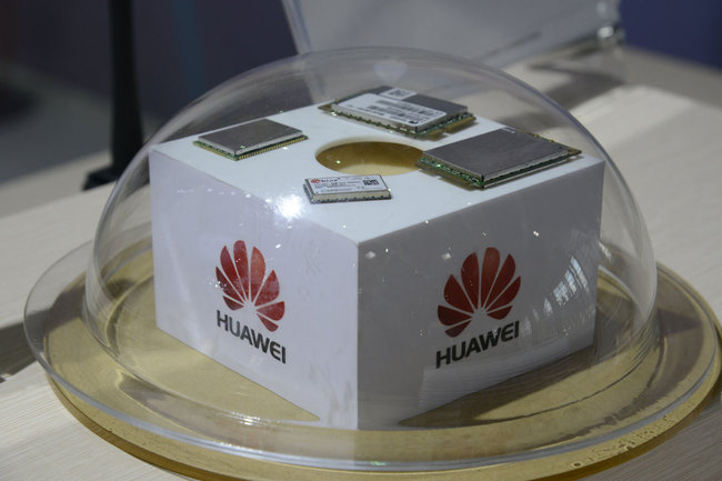 Huawei electronic components seen under a protective glass dome at the Huawei stand at the CeBIT computer trade show in Hanover, Germany, 16 March 2016. [Photo: IC]