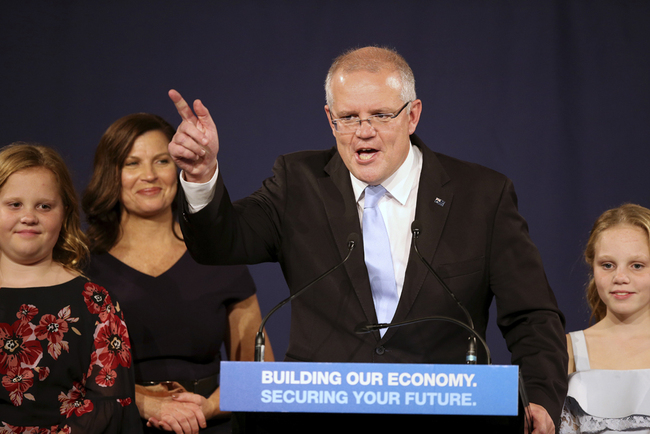 Australian Prime Minister Scott Morrison speaks to party supporters flanked by his wife, Jenny, second left, and daughters Lily, right, and Abbey, after his opponent conceded in the federal election in Sydney, Australia, Sunday, May 19, 2019. [Photo: AP]