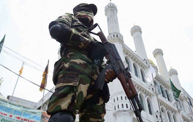 A Sri Lankan security guard stands outside a mosque in Colombo on May 17, 2019. [Photo: AFP]