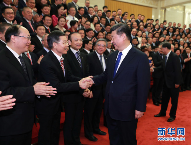 President Xi Jinping meets with overseas Chinese representatives who are in Beijing to attend the ninth Conference for Friendship of Overseas Chinese Associations and a plenary session of the board of directors of the China Overseas Friendship Association on May 28, 2019. [Photo: Xinhua]