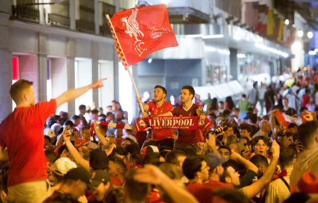 Liverpool supporters celebrate at Puerta del Sol their team's win against Tottenham Hotspur during the UEFA Champions League final football match at Plaza Mayor in Madrid on June 2, 2019. [Photo: AFP]