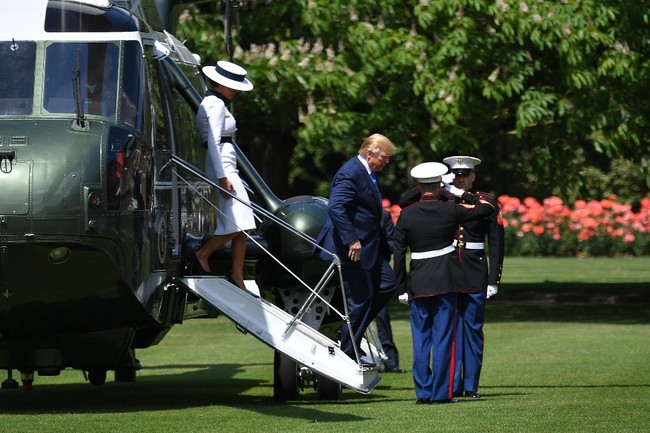 US President Donald Trump and US First Lady Melania Trump step off Marine One to attend a welcome ceremony at Buckingham Palace in central London on June 3, 2019. [Photo: AFP]