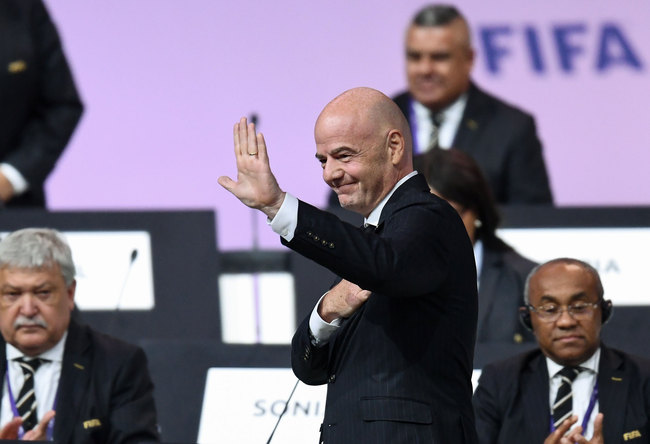 FIFA President Gianni Infantino (C) reacts after being re-elected by acclamation for a second term at the 69th FIFA Congress at Paris Expo, Porte de Versailles in Paris on June 5, 2019. [Photo: AFP/FRANCK FIFE]