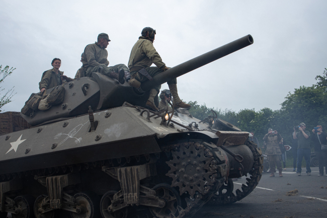 Reenactors drive a tank during a parade not far from Sainte Mere Eglise, northern France, to celebrate the 75th anniversary of the D-Day landing, on June 4, 2019. [Photo: AFP/Federico Scoppa]