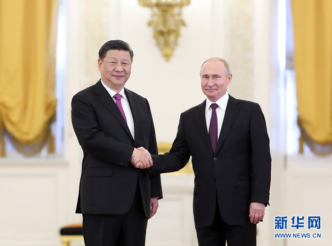Chinese President Xi Jinping and his Russian counterpart, Vladimir Putin shake hands before their talks in the Kremlin in Moscow on June 5, 2019. [Photo: Xinhua]