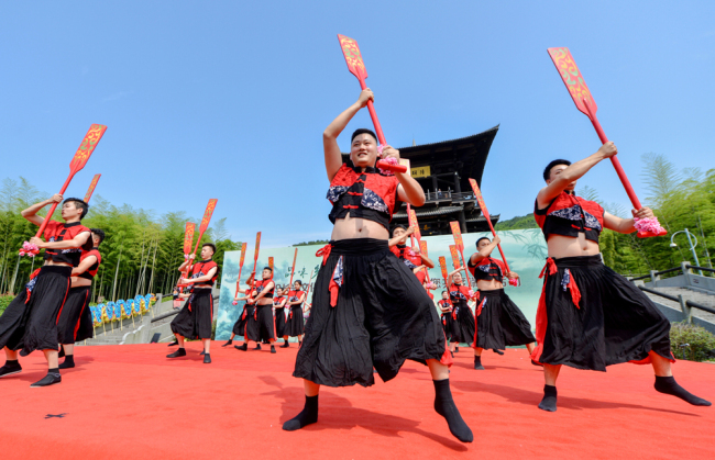 People dance to celebrate this year’s cultural and natural heritage day, which falls on June 8, 2019. [Photo: IC]