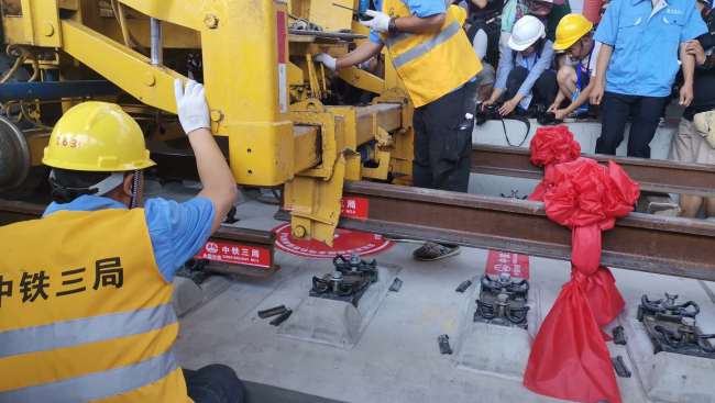 The entire track-laying construction for the Beijing-Zhangjiakou high-speed railway is completed on June 12, 2019. [Photo: China Plus]