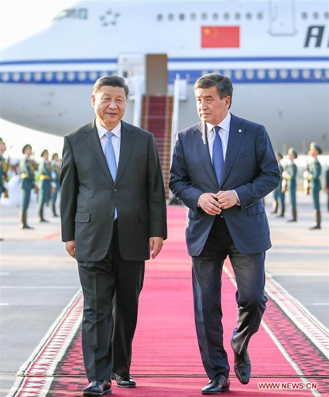 Chinese President Xi Jinping has a cordial talk with his Kyrgyz counterpart Sooronbay Jeenbekov upon his arrival in Bishkek, Kyrgyzstan, June 12, 2019. Xi arrived here Wednesday for a state visit to Kyrgyzstan and the 19th Shanghai Cooperation Organization (SCO) summit. [Photo: Xinhua/Xie Huanchi]