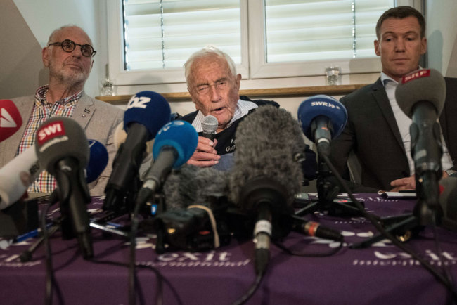 Australian scientist David Goodall attends a press conference flanked by Exit International founder and director Dr. Philiip Nitschke (L) and Dr. Moritz Gall (R) on May 9 2018, on the eve of his assisted suicide in Basel. A 104-year-old Australian scientist David Goodall, resentful that he was forced overseas to die, gave a press conference along side Gall and Exit International founder and director Dr. Philiip Nitschke in Switzerland a day before he is due to end his life. Goodall does not have a terminal illness but says his quality of life has deteriorated and that he wants to die. Goodall, who according to Exit International attempted but failed to commit suicide on his own earlier this year, secured a fast-track appointment with assisted dying foundation Eternal Spirit in Basel. [File photo: AFP/Sebastien Bozon]