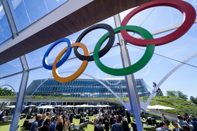 Guest visit and enjoy the garden of the Olympic house, the new International Olympic Committee (IOC) headquarters, after the inauguration ceremony in Lausanne, on June 23, 2019 ahead of the decision on 2026 Winter Games host. [Photo: FABRICE COFFRINI / POOL / AFP]