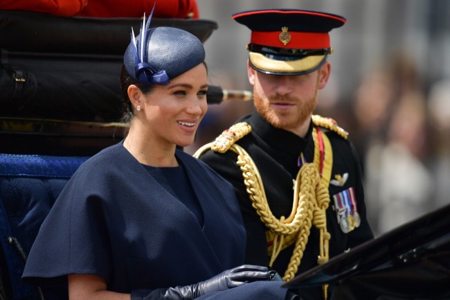 Britain's Meghan, Duchess of Sussex (L) and Britain's Prince Harry, Duke of Sussex (R) return to Buckingham Palace after the Queen's Birthday Parade, 'Trooping the Colour', in London on June 8, 2019. [Photo: AFP/Daniel LEAL-OLIVAS]