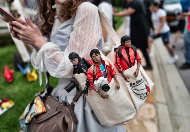 Yasuyo, from Yokahama, Japan, carries her Michael Jackson dolls as she pays her respects at Jackson's mausoleum at Forest Lawn Cemetery In Glendale, Calif., on the 10th Anniversary of Jackson's death on Tuesday, June 25, 2019. Fans are gathering to pay tribute to the King of Pop, with fans congregating his former home, the cemetery where he is interred and his star on the Hollywood Walk of Fame. His estate is calling on the superstar’s fans to perform acts of service in Jackson’s memory. [Photo: AP/Richard Vogel]