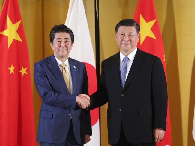 Chinese President Xi Jinping (R) meets with Japanese Prime Minister Shinzo Abe in Osaka, Japan, June 27, 2019. [Photo: Xinhua]