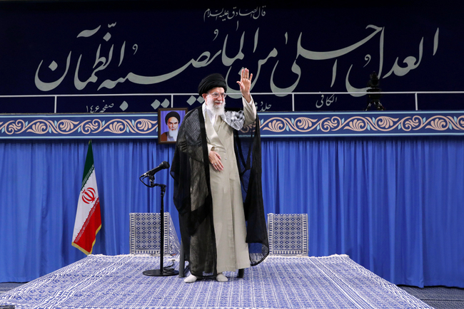 A handout picture provided by the office of Iran's Supreme Leader Ayatollah Ali Khamenei on June 26, 2019 shows him waving to the crowd during a gathering of the judiciary in the Islamic republic's capital Tehran. [Photo: AFP/HO/Khamenei.Ir]