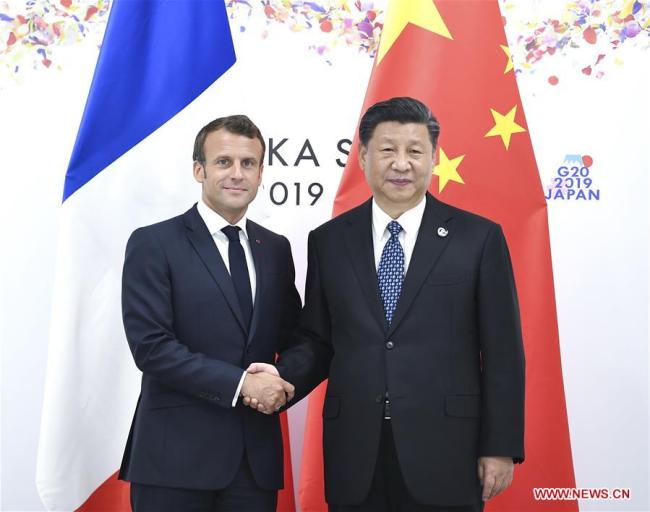 Chinese President Xi Jinping (R) meets with his French counterpart Emmanuel Macron in Osaka, Japan, June 29, 2019. [Photo: Xinhua]