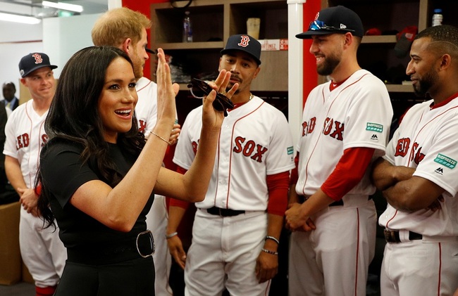 Britain's Prince Harry, Duke of Sussex and his wife Meghan, Duchess of Sussex meet Boston Red Sox players ahead of their match against the New York Yankees at London Stadium in Queen Elizabeth Olympic Park, east London on June 29, 2019, for the first of a two-game Baseball series in London. [Photo: AFP]