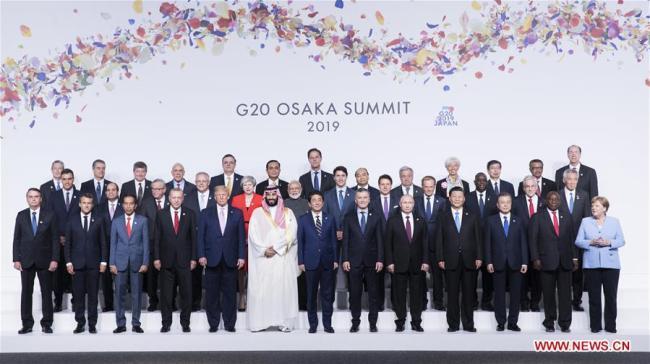 Chinese President Xi Jinping(4th R, front) poses for a group photo with the other leaders attending the 14th G20 summit held in Osaka, Japan, June 28, 2019. Xi called on G20 to join hands in forging high-quality global economy while addressing the 14th G20 summit held in the Japanese city of Osaka. [Photo: Xinhua/Huang Jingwen]